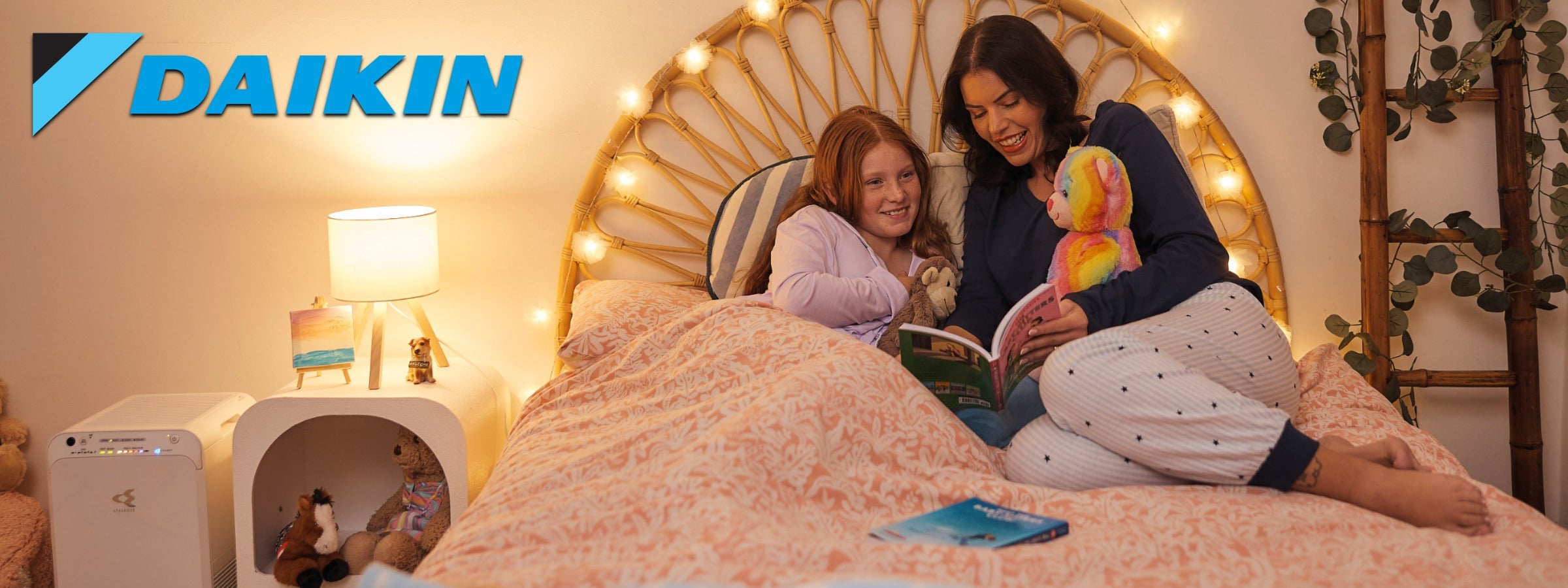 Woman sitting on a couch with an air purifeir in the foreground